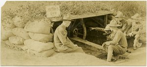 Five Soldiers Gathered Around and Learning About a Camouflaged Artillery by Carl Michel